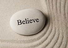 believe-inspirational-stone-surrounded-by-sand-ripples-zen-concept-stock-photos_csp12393730